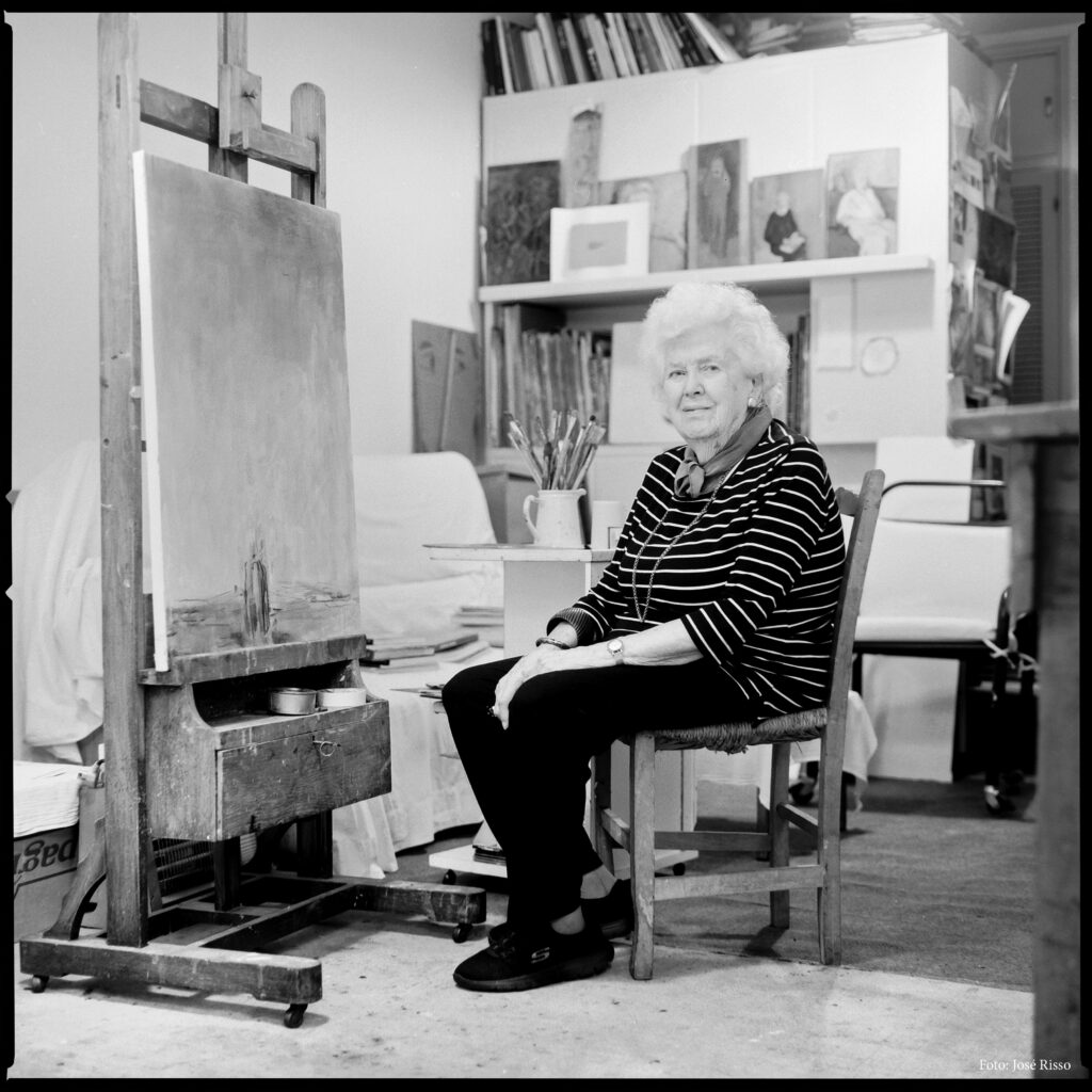 Artist Linda Kohen Sitting In Her Workshop