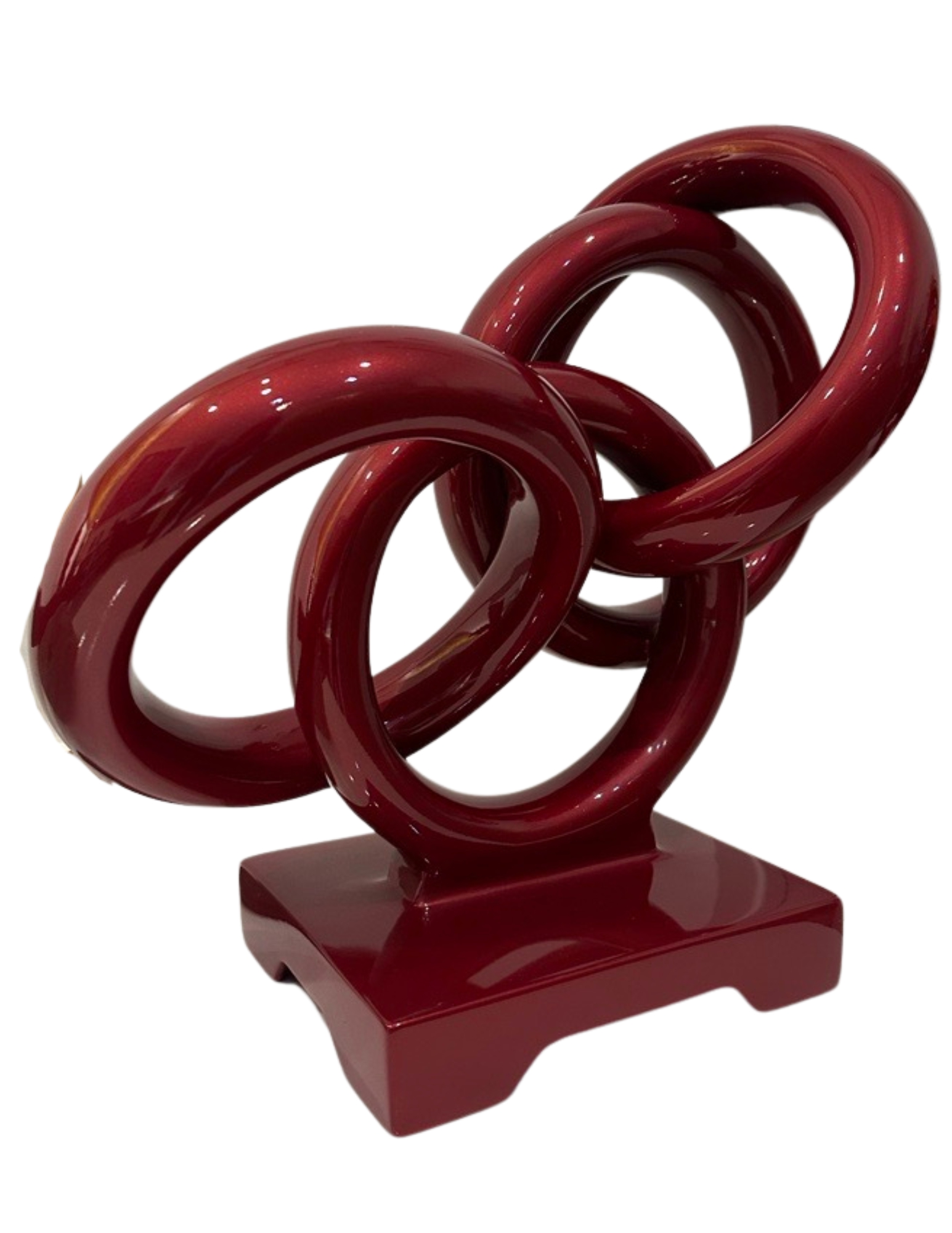 A Red Sculpture Of Several Floating Circle Rings Interlocking With Each Other Made Of Iron By Artist Ilse De Manazanares.